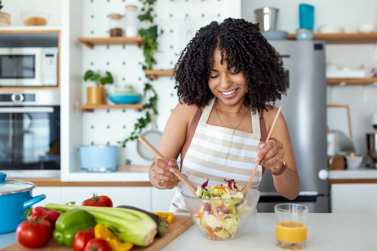 woman making salad