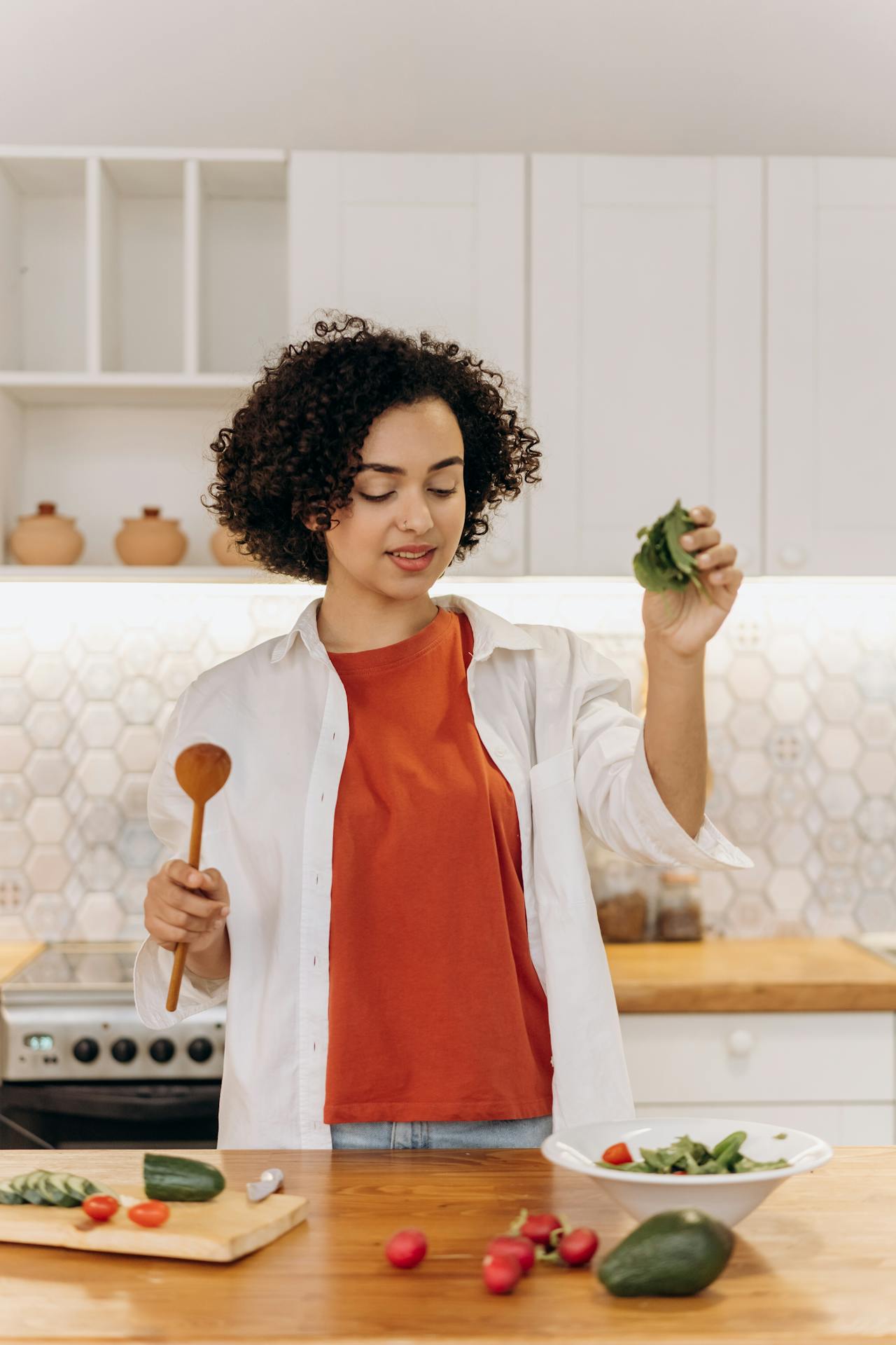 woman prepares food in the kitchen